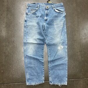 Vintage 90s Wrangler 35x27 Light Wash Denim Blue Jeans
